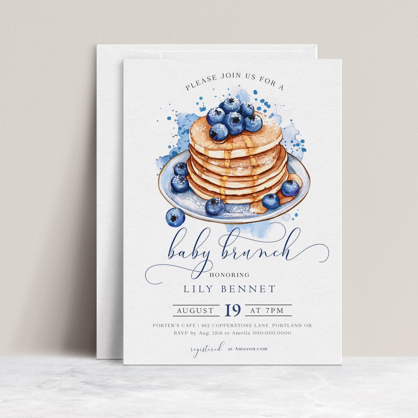 Blueberry baby brunch invitation with a watercolor stack of pancakes, syrup, and blueberries in blue and white