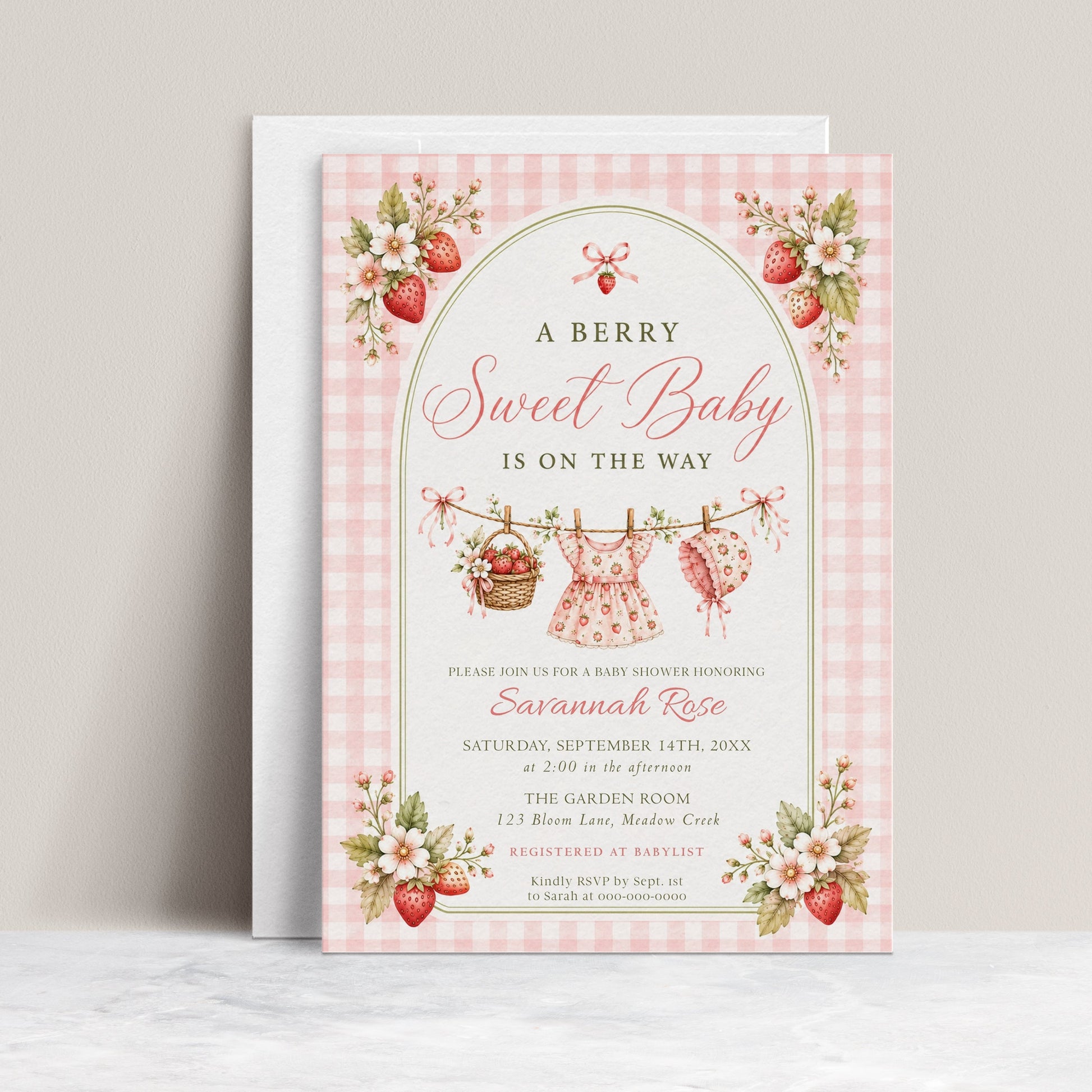 Editable strawberry baby shower invitation Canva template with watercolour strawberries, white blossoms, clothesline scene, and pink gingham background, shown with front and back of card