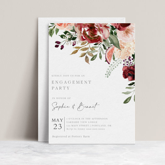 Autumn floral engagement party invitation template with watercolor blooms in burgundy, blush, and plum with dark green botanicals, editable in Canva