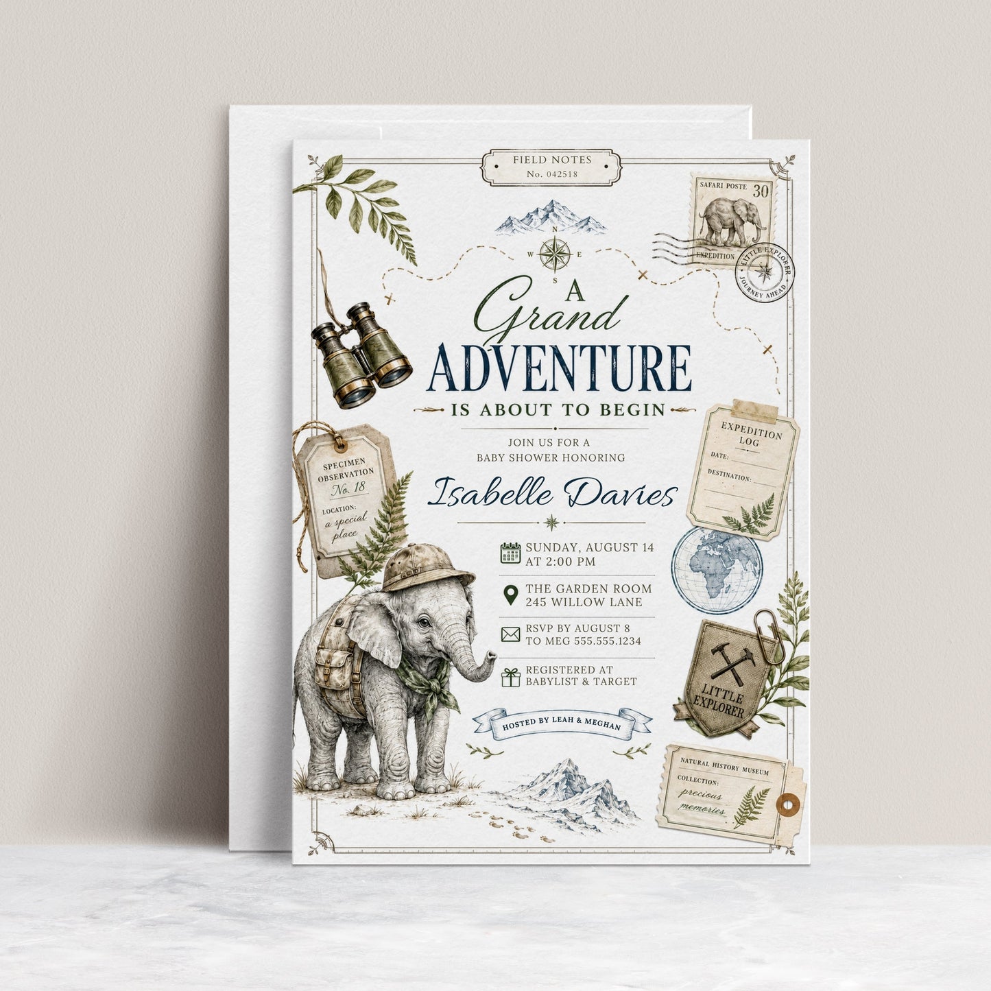 Grand adventure baby shower invitation with safari elephant, binoculars, compass, expedition tags, postage stamp, globe, mountains, greenery, and vintage explorer details