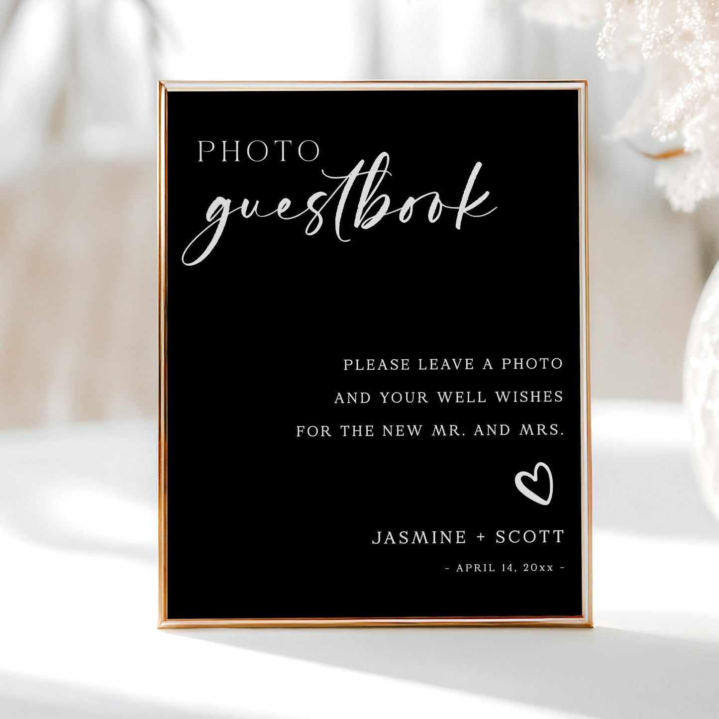 Black minimalist photo guestbook sign with elegant script and serif font, editable for wedding decor | www.foreveryourprints.com