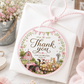 Round barnyard birthday thank-you sticker featuring a pink tractor, barn, cow, pig, pony, chick, puppy, kitten, flowers and pastel bunting.