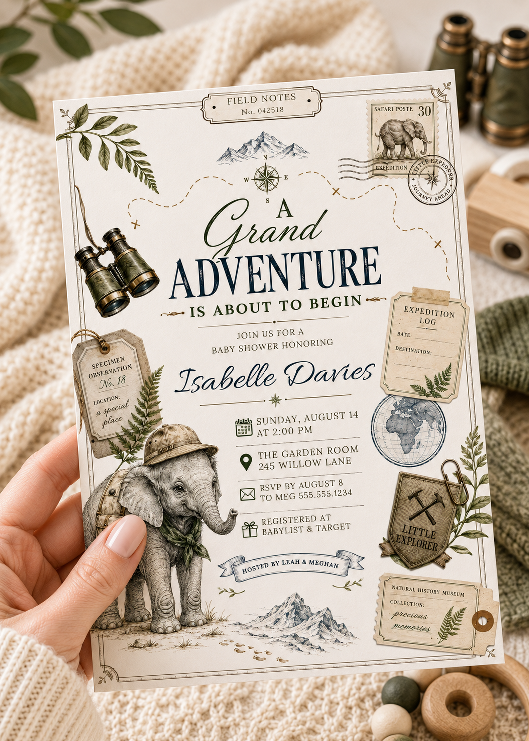 Grand adventure baby shower invitation with safari elephant, binoculars, compass, expedition tags, postage stamp, globe, mountains, greenery, and vintage explorer details
