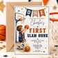 Basketball first birthday invitation featuring a little boy shooting a basketball, hoop, ONE banner, stars and navy and orange sports details.

