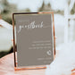 Photo guestbook sign with elegant white script on beige background, includes heart accent and space for couple’s names and date | Editable template via Corjl | www.foreveryourprints.com